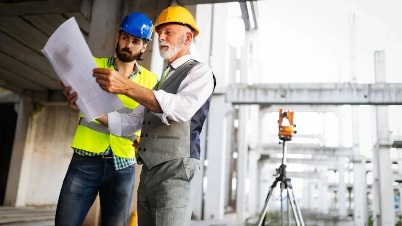 Site planning documents and technical drawings on a desk